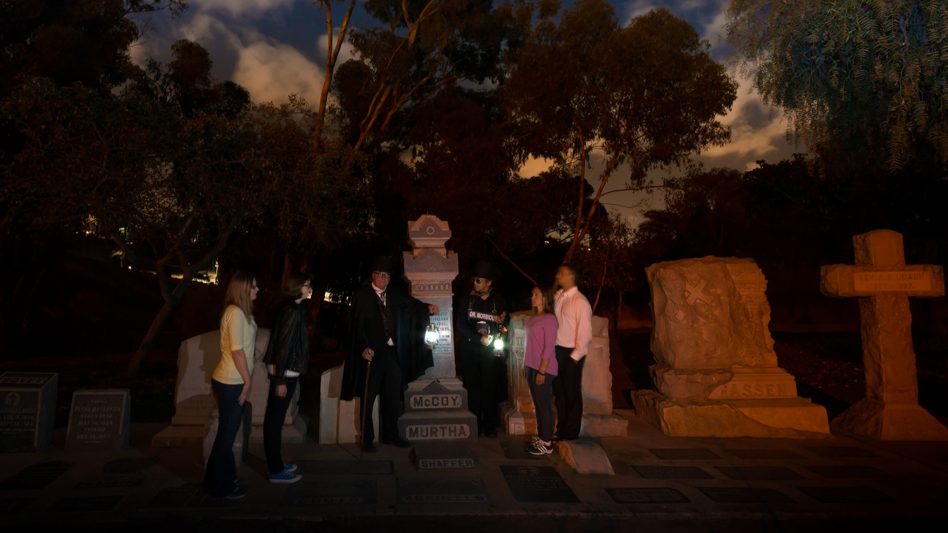 people on a tour in a graveyard
